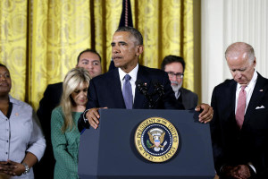 President Barack Obama, joined by Vice President Joe Biden and gun violence victims, speaks earlier today in the East Room of the White House about steps his administration is taking to reduce gun violence. Also on stage are stakeholders, and individuals whose lives have been impacted by the gun violence. CAROLYN KASTER / AP